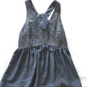 Black and gold V neck blouse